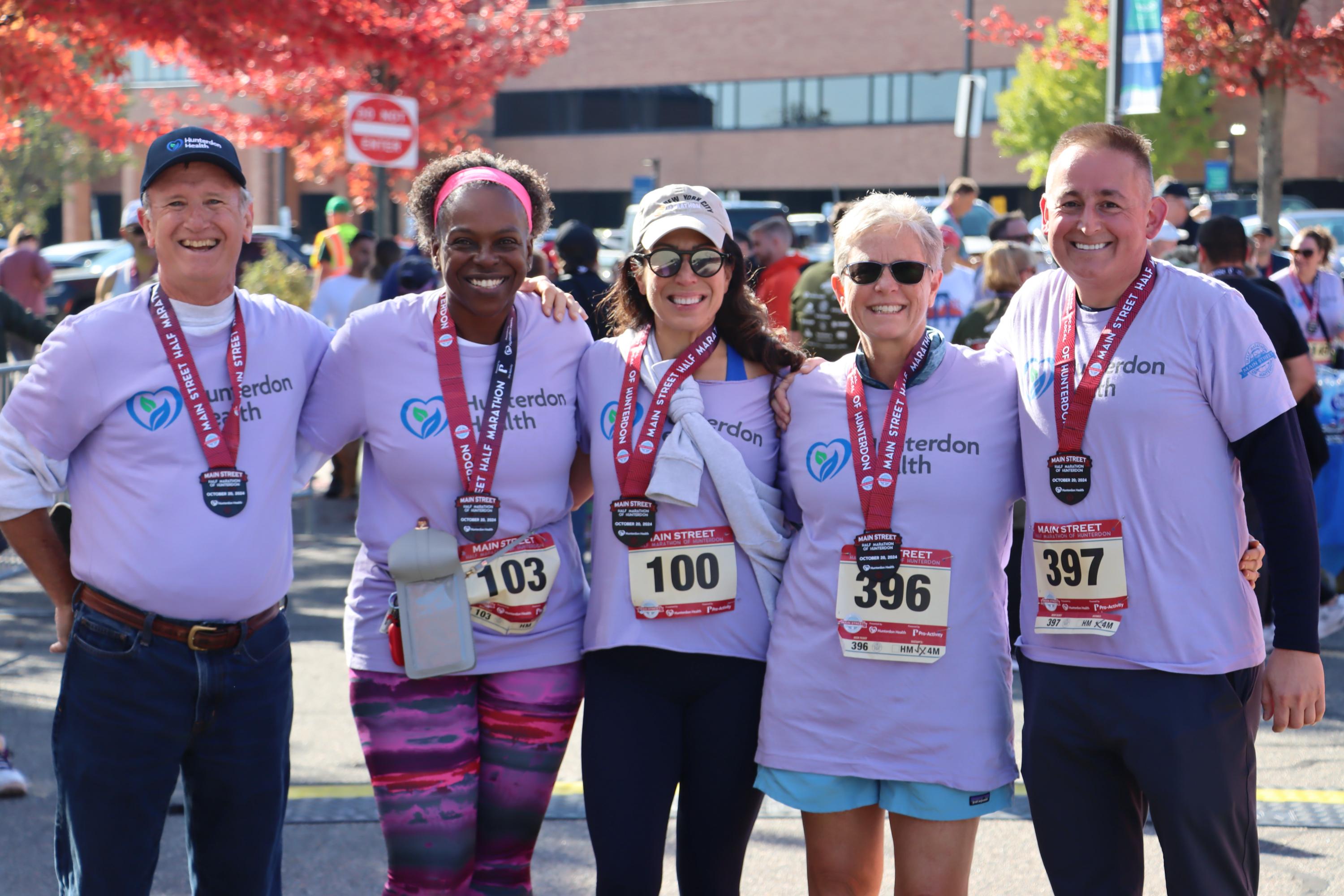 Board Members pose at Half-Marathon and 4-Mile Walk finish line