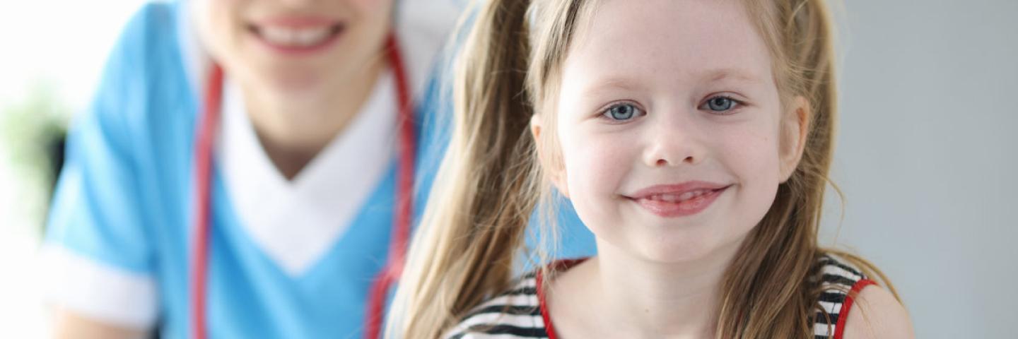 Child smiling at a Pediatric Doctors Appointment