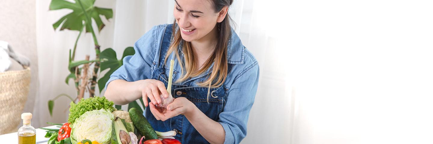 woman cooking vegetables