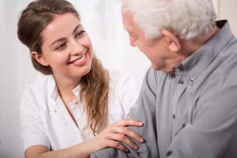 Female nurse with elderly man